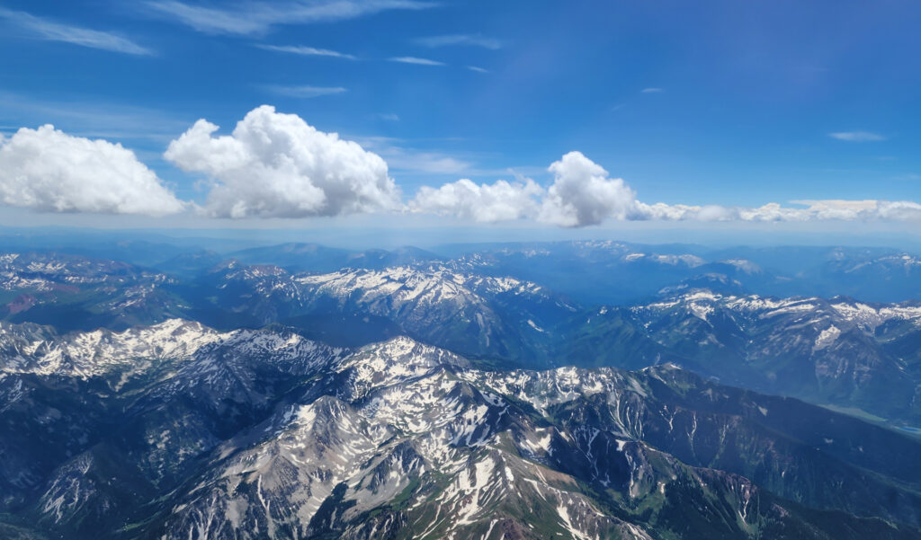 A view of the Rocky Mountains and the Aspen area from the window of a commercial jet.